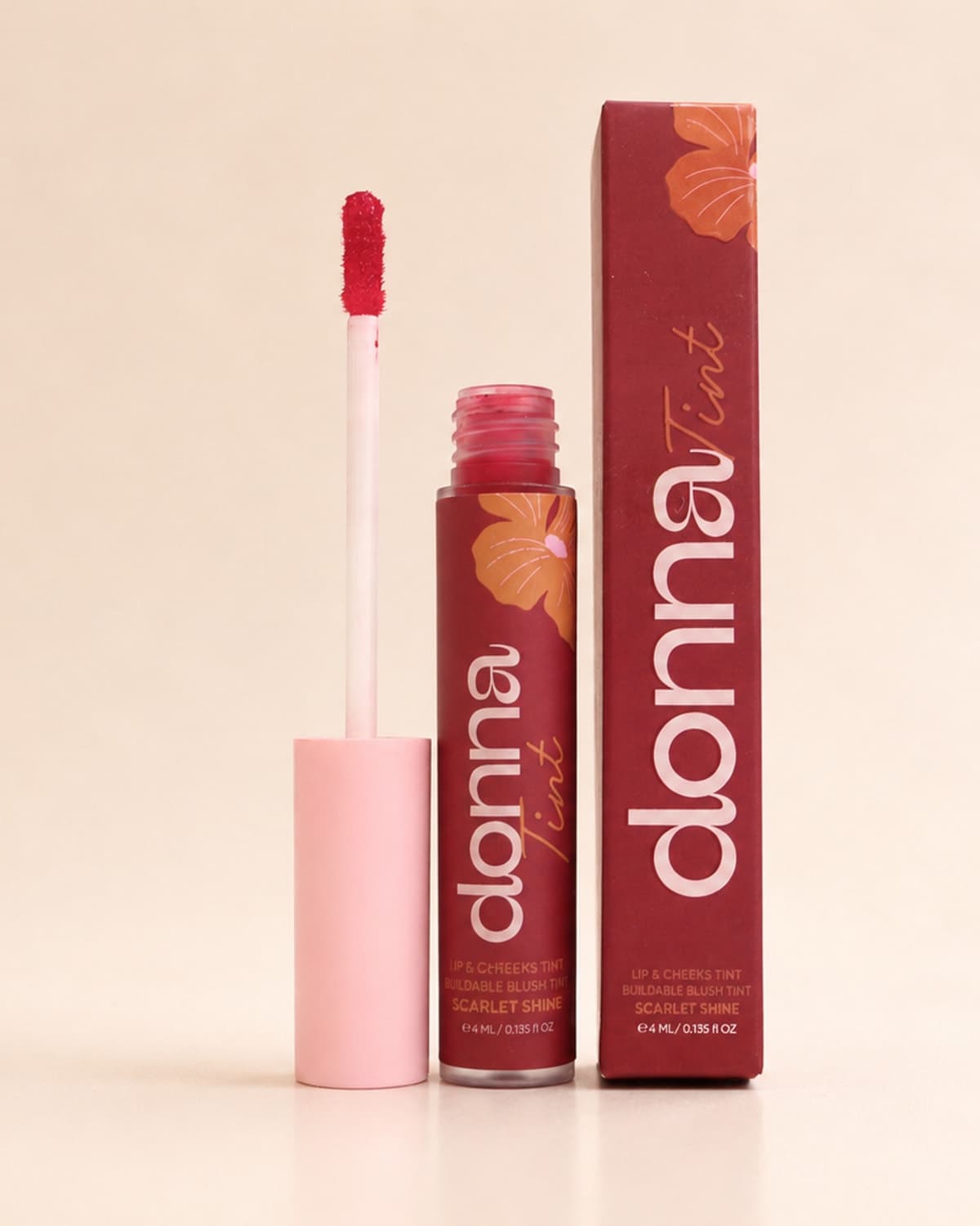 Donna Scarlet Shine Lip & Cheek Tint with its applicator and carton