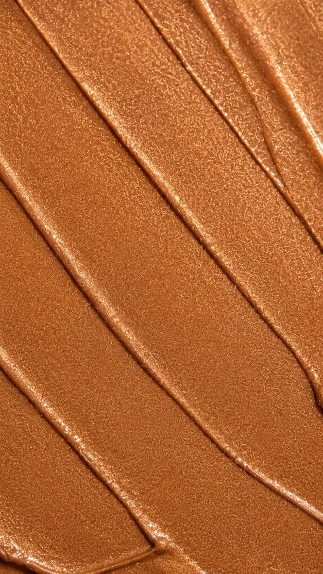 Close-up smear of Bronze Glow Body Shimmer texture