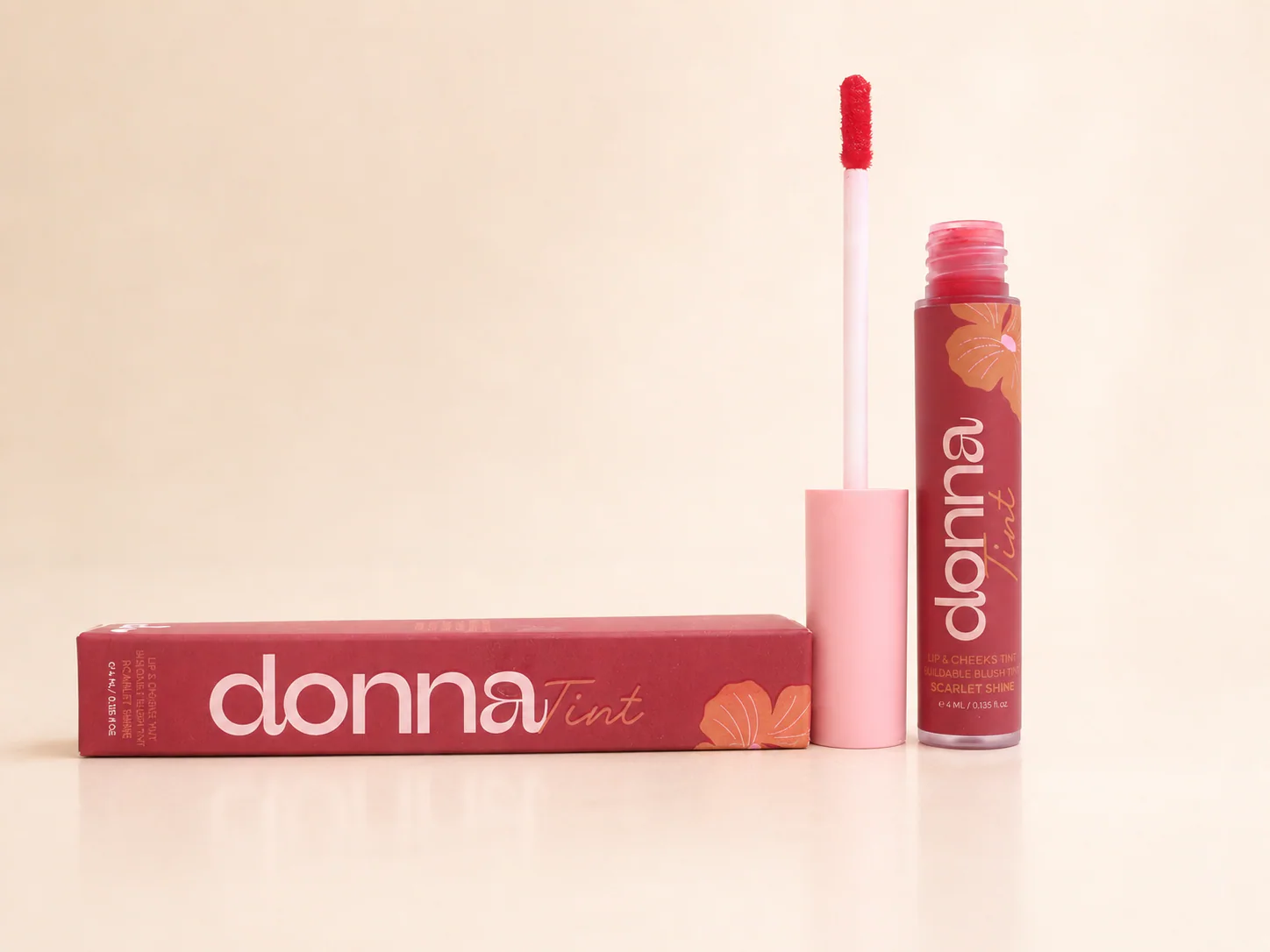 Open Scarlet Shine tint, applicator, and carton