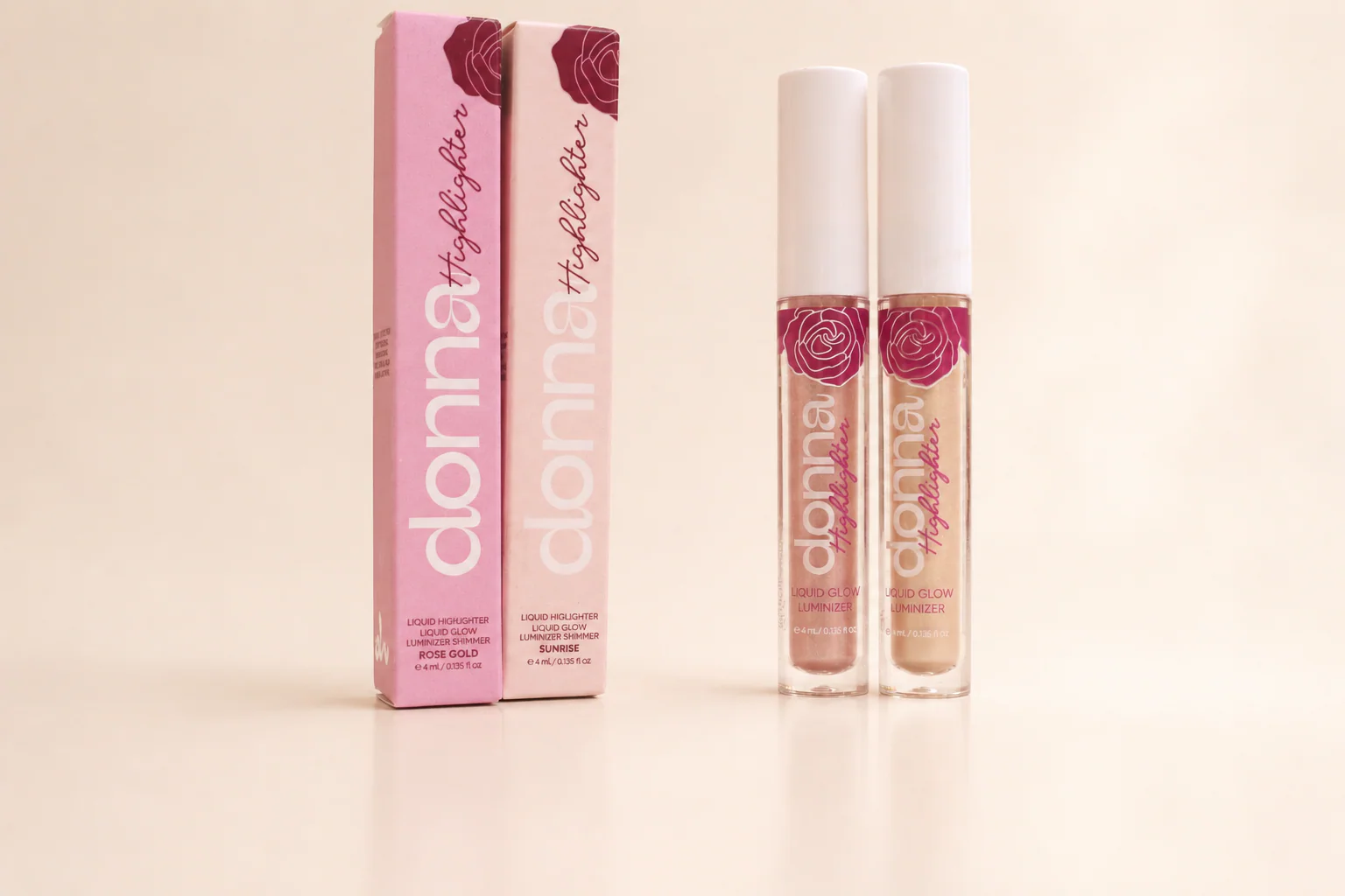 Donna Sunrise and Rose Gold Liquid Highlighter tubes with their cartons